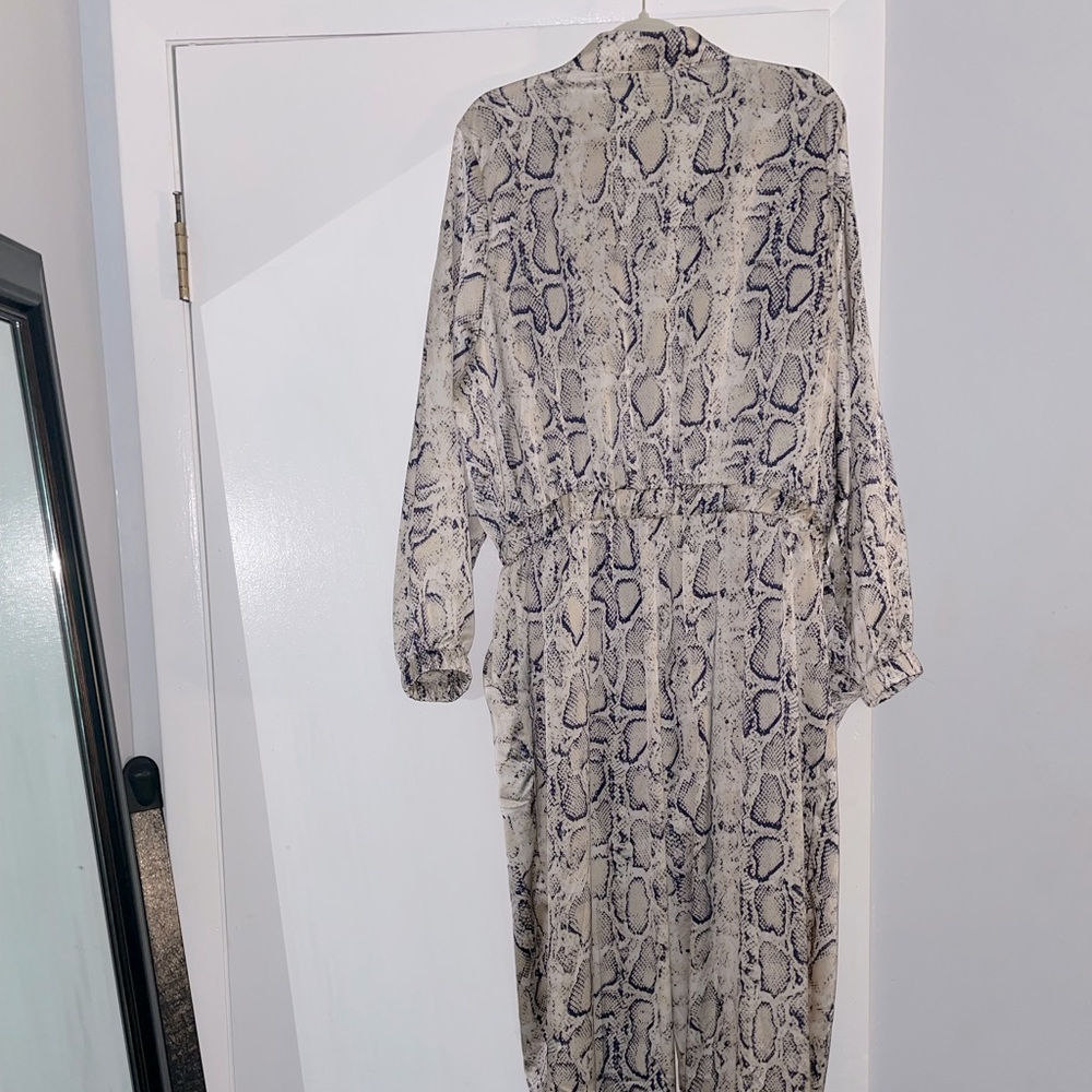 Fashion to Figure Snake print jumpsuit. Lightweight with pockets